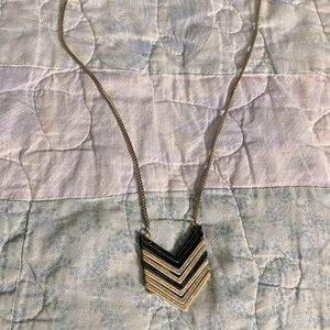 Gold and black arrow design necklace